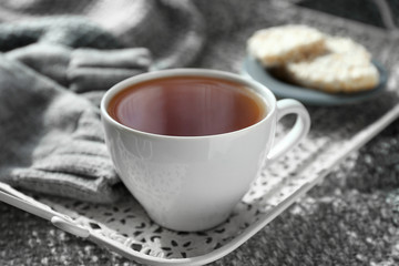 Cup of hot tea on tray
