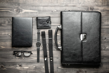 Set of male accessories on wooden background