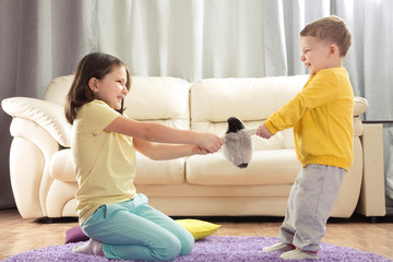 the conflict between a boy and a girl. the kids are fighting, the boy takes the girls toy. sibling...