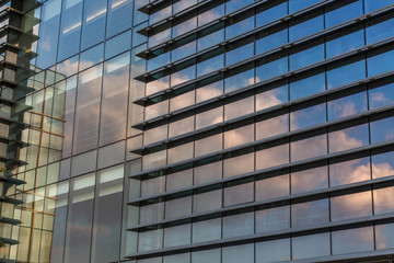 Clouds Reflected in Windows of Modern Office Building.