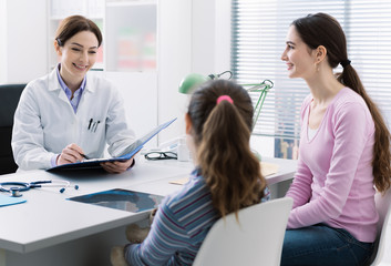 Smiling mother and child in the doctor's office
