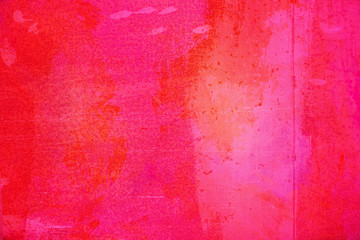 The abstract bright red surface has a brush painted on the background for graphic design.