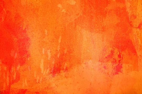The abstract bright 0range surface has a brush painted on the background for graphic design.