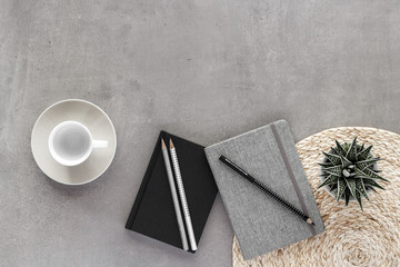 coffee cub pencil notepad notes plant stone granite texture  top view with copy space for your text. flat lay. 