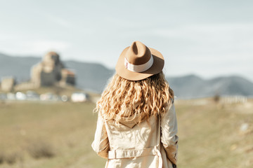 Girl travel blogger outdoors. The ancient capital and the Jvari monastery, Georgia.