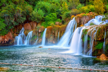 Amazing nature landscape, beautiful waterfall at sunrise, famous Skradinski buk, one of the most beautiful waterfalls in Europe and the biggest in Croatia, outdoor travel background