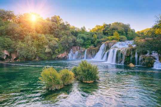 Amazing nature landscape, beautiful waterfall at sunrise, famous Skradinski buk, one of the most beautiful waterfalls in Europe and the biggest in Croatia, outdoor travel background