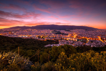 View of eastern Athens and Hymettus mountain from Lycabettus hill at dawn. 