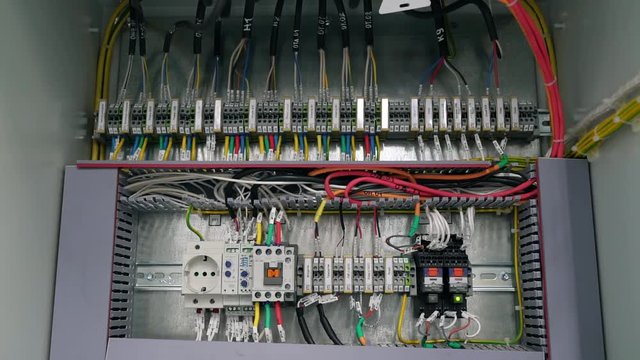 electrical box contains many terminals, relays, wires and switches. Manufacture and installation concept concept.