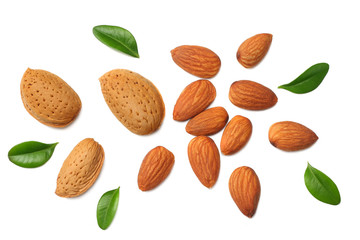 almonds with green leaves isolated on white background. top view.