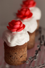 Easter cake with decorative sweet red flowers