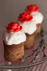 Easter cake with decorative sweet red flowers