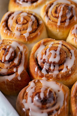 cinnamon rolls on wooden surface