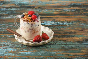 Series about granola, berry and greek yogurt suitable for a healthy breakfast, snack or dessert.
