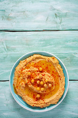 hummus on a turquoise surface