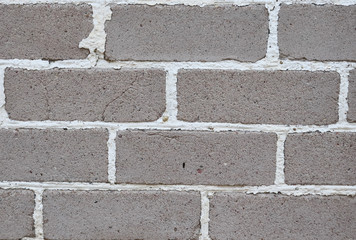 Old brickwork. Brick wall. White silicate brick. Crumbling brick from time to time.