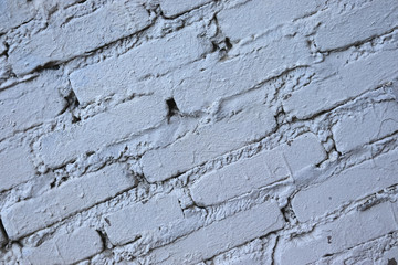 Old brickwork. Brick wall. White silicate brick. Crumbling brick from time to time.