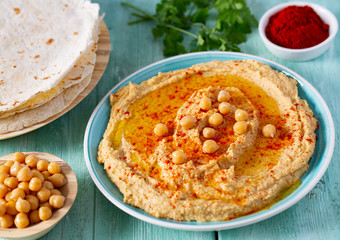 hummus on a turquoise surface