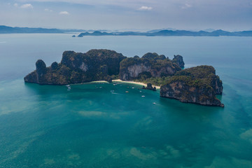 Top view of limestone island in blue sea with turquoise lagoon water bay and beach in Ko hong, Thailand