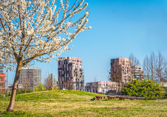 Bologna Quartiere Navile in Italy with Trilogia Navile modern building city park in spring © Luca Lorenzelli