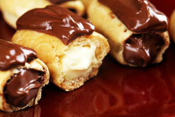 Traditional French dessert. Eclair with chocolate icing. Pastery concept with chocolate eclair