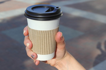 Paper cup in hand