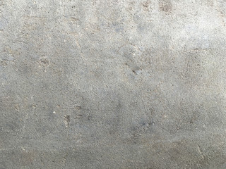 Uneven putty texture. Rough and grungy background of putty