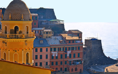 Vernazza village with typical colorful multicolored buildings houses, Castello Doria castle on...