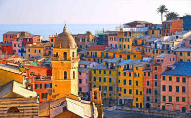 Vernazza village with typical colorful multicolored buildings houses, Castello Doria castle on...