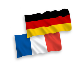 National vector fabric wave flags of France and Germany isolated on white background. 1 to 2 proportion.