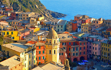 Vernazza village with typical colorful multicolored buildings houses, Castello Doria castle on rock, Ligurian Sea in background, National park Cinque Terre, La Spezia, Liguria, Italy