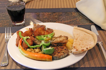 Lunch at restaurant with fresh vegetable pepper, paprika, lime and glass of cola