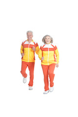Active senior couple exercising on white background