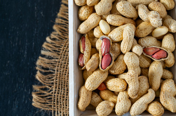 peanuts on a dark surface
