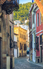 Picturesque narrow alley and neoclassical buildings, characteristics in the  old town of Xanthi.