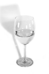 glass of water on a white background in black and white