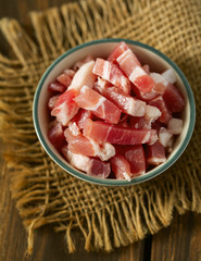 bacon cubes on wooden surface