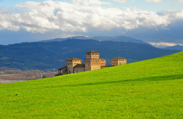 green landscape on hills around Parma and grass field near Torrechiara castle,  Italy