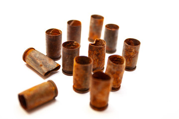 A pile bullet shells on a white background