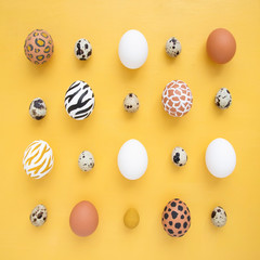 Dyed Easter eggs on yellow background. Creative animal pattern.