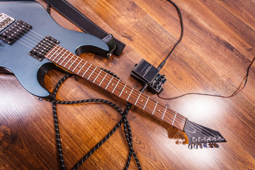 Black electric guitar with equipment