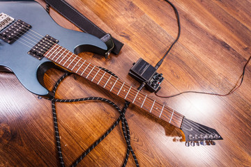 Black electric guitar with equipment