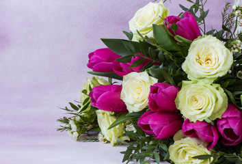 on a pink background, a bouquet of white roses and pink tulips