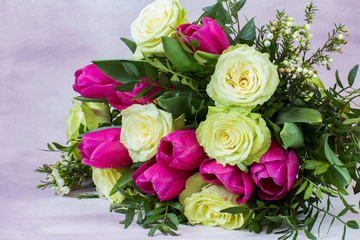 on a pink background, a bouquet of white roses and pink tulips