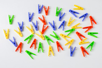 on white background colorful clothespins
