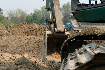 Fototapeta na wymiar excavator digging making pond. earthmoving work