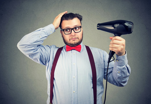 Eccentric Man In Glasses Drying His Hair