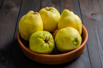 Quince on a dark background.