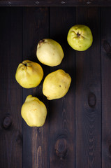 Quince on a dark background.