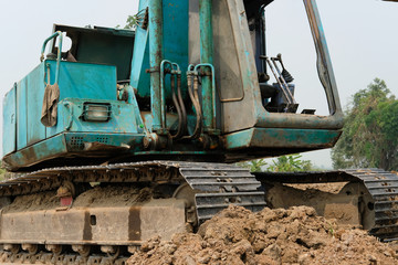 Fototapeta na wymiar excavator backhoe tractor at construction site